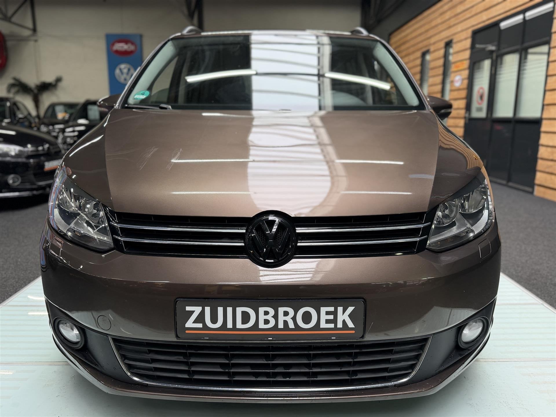 Volkswagen Touran 1.2 TSI 7-PERSOONS! Cruise! Clima! Navi!, Auto's, Gebruikt, 4 cilinders, Bruin, Bedrijf