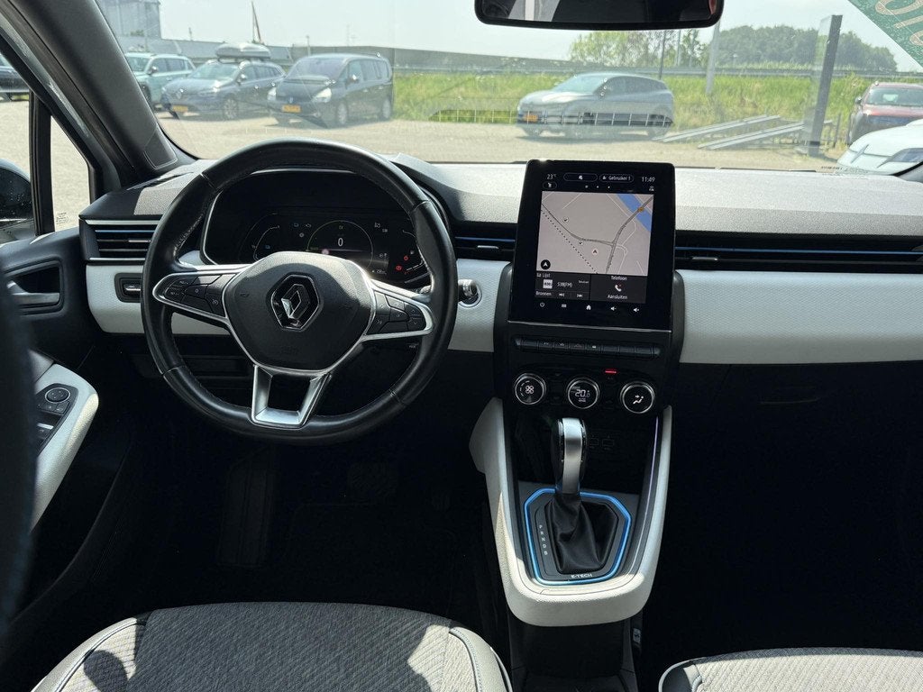Renault Clio 1.6 E-Tech Hybrid 140 Serie Limitee E-TECH | NA, Auto's, Gebruikt, 4 cilinders, Met garantie (alle), Wit