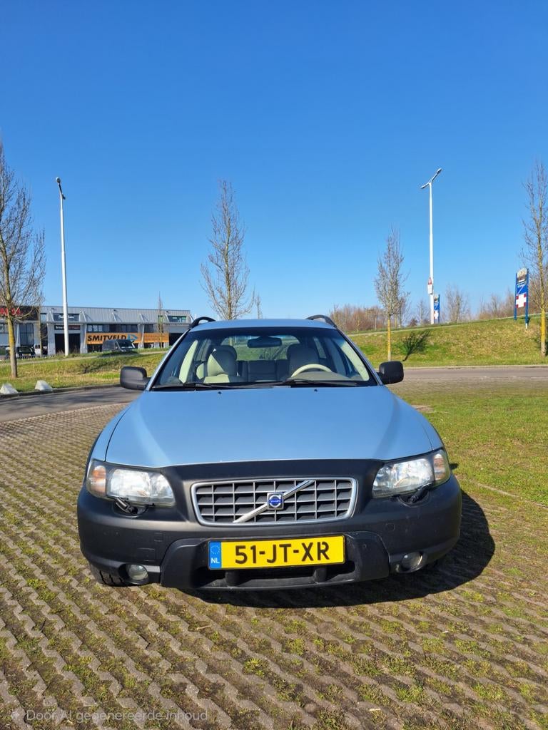 Volvo V70 2.4 T XC 4WD AUT 2002 Blauw, Auto's, 1800 kg, Beige, Blauw, Stationwagon