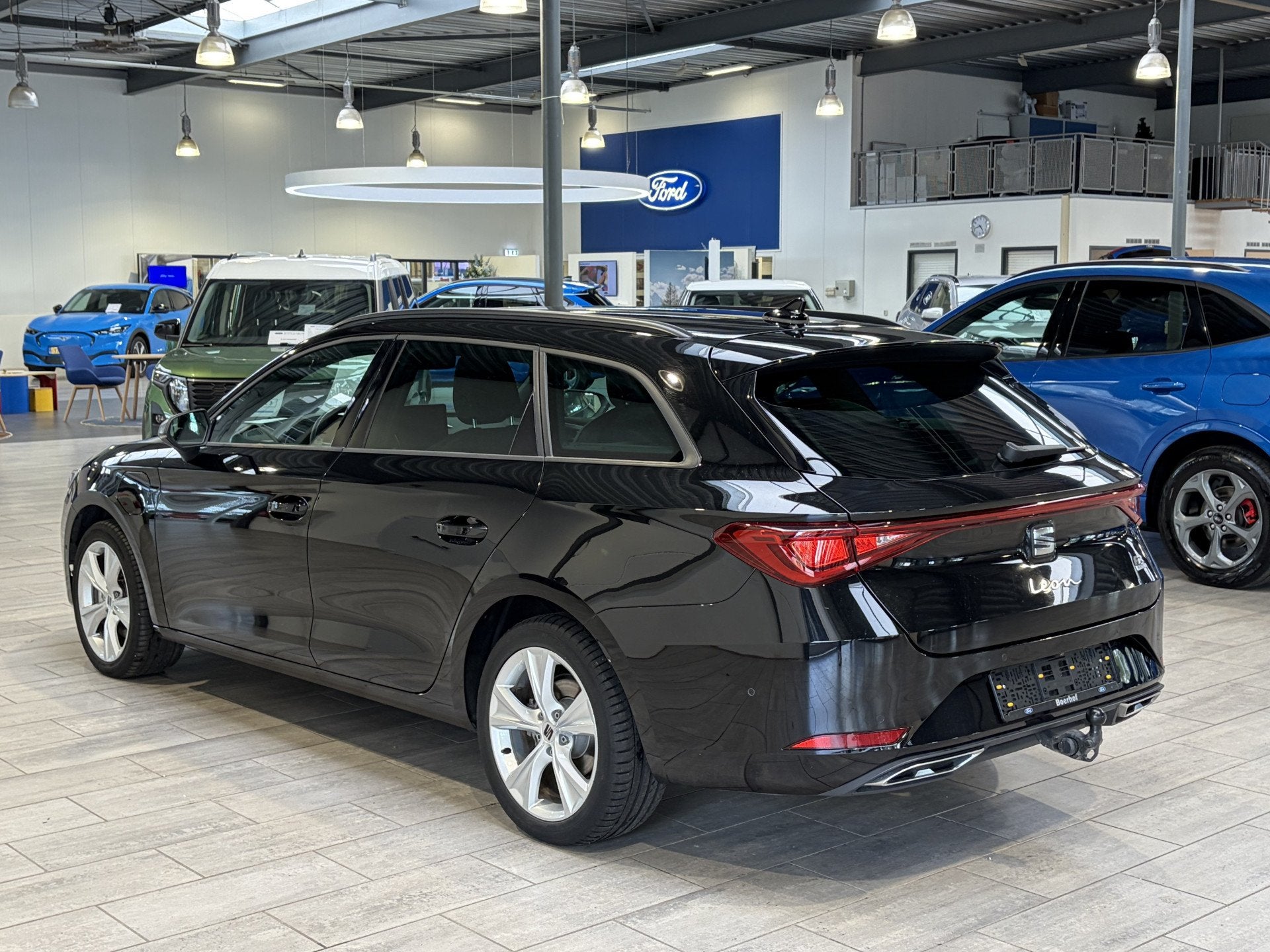 SEAT Leon Sportstourer 1.5 TSI e-Hybrid PHEV 204 pk FR Busin, Auto's, 12 maanden, Stof, Zwart, 4 cilinders