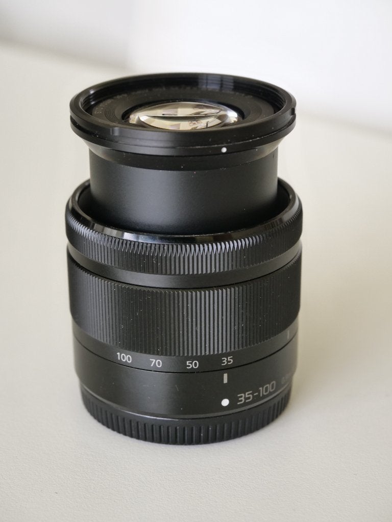 Panasonic 35-100 4-5.6 /  35-100mm Mega OIS, MFT, zgan, Zonnekap, Micro Four Thirds, Zo goed als nieuw, Panasonic