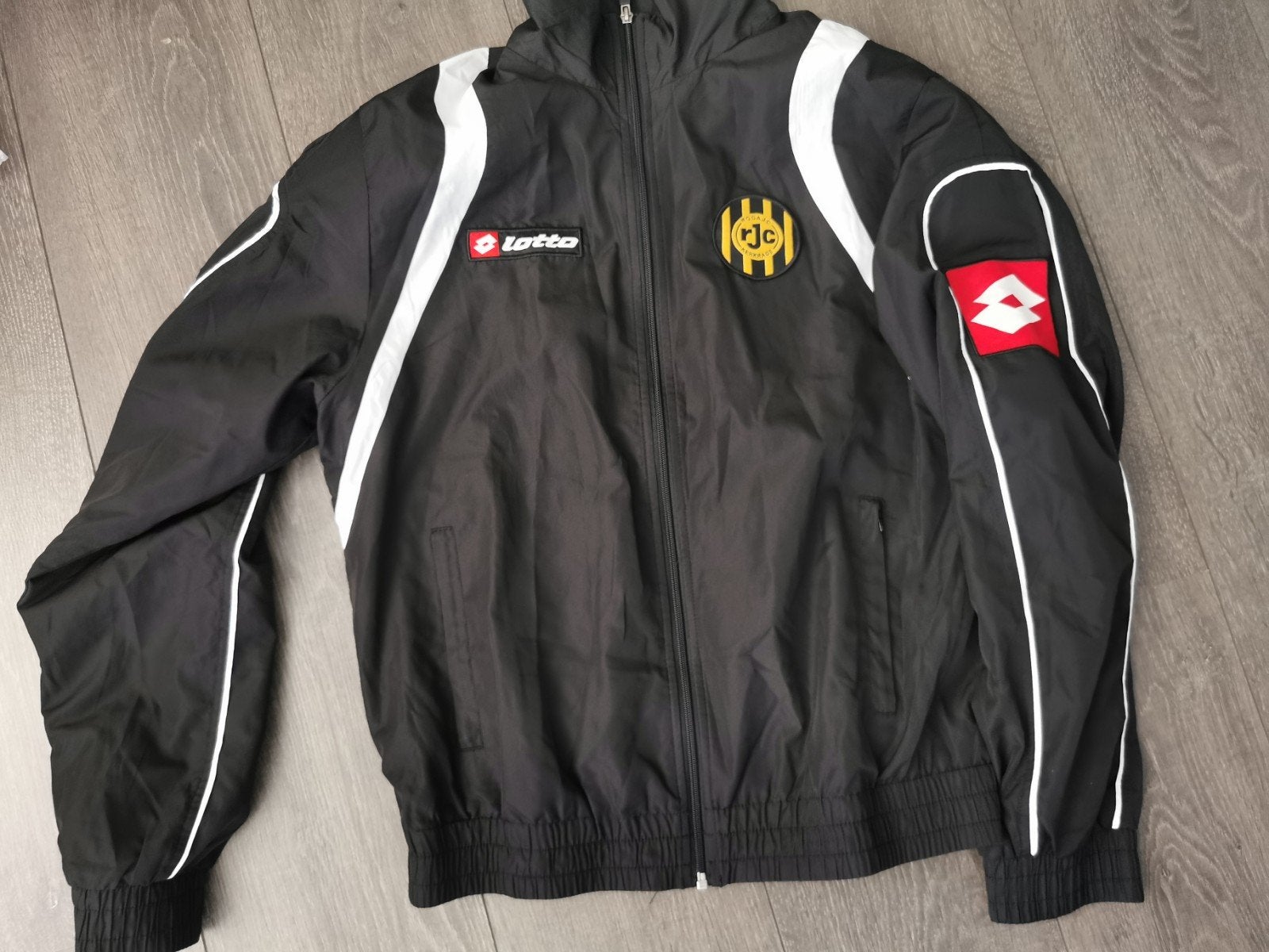 Lotto sportjack Roda JC zwart - Maat M, Ophalen, Lotto, Maat 48/50 (M), Zwart