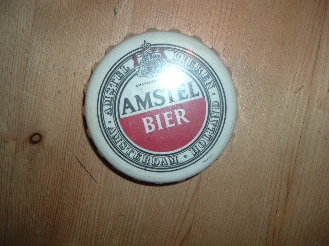 Amstel viltjes (nr.1) verpakt in plastic kroonkurk, Verzamelen, Ophalen of Verzenden, Nieuw, Viltje(s), Amstel