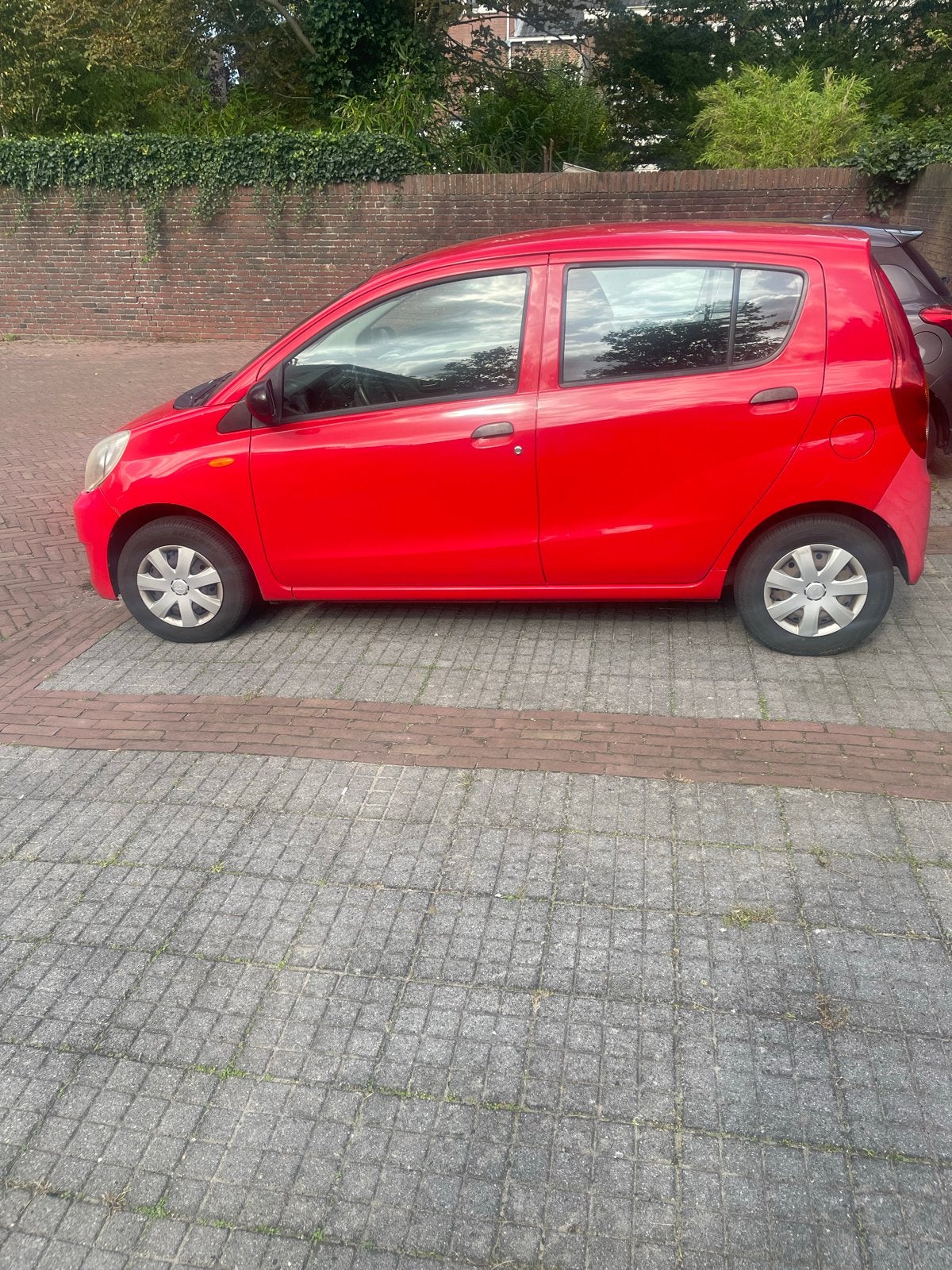 Daihatsu Cuore 1.0 5D 2011 Rood, Voorwielaandrijving, 600 kg, 18 €/maand, 4 stoelen