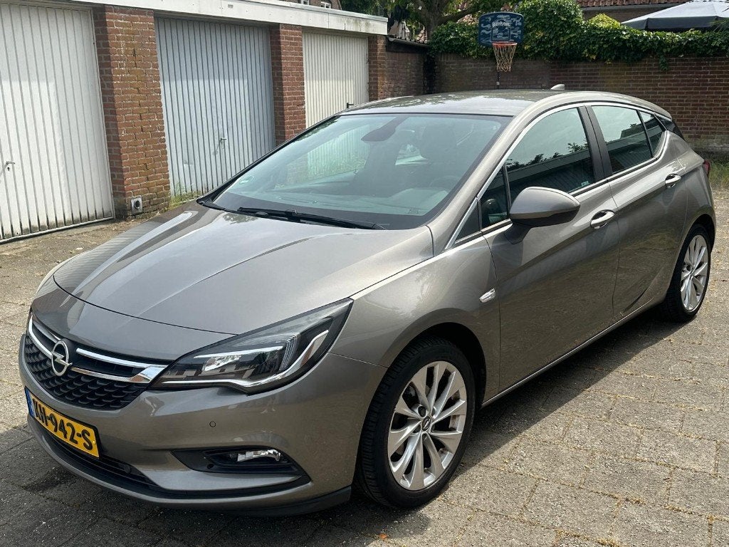 Opel Astra 1.0 Turbo 77KW 5D 2016 Bruin (2e Eigenaar), Auto's, Stof, 610 kg, 23 km/l, Origineel Nederlands