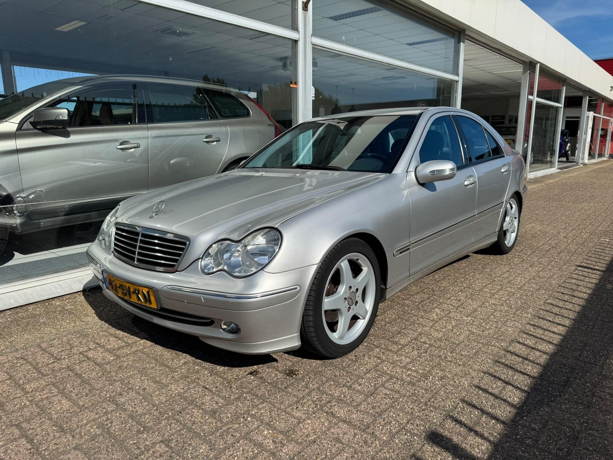 Mercedes-Benz C-klasse 180 K. Elegance | Airco | Elektrische, Auto's, Gebruikt, Zwart, 1796 cc, Handgeschakeld