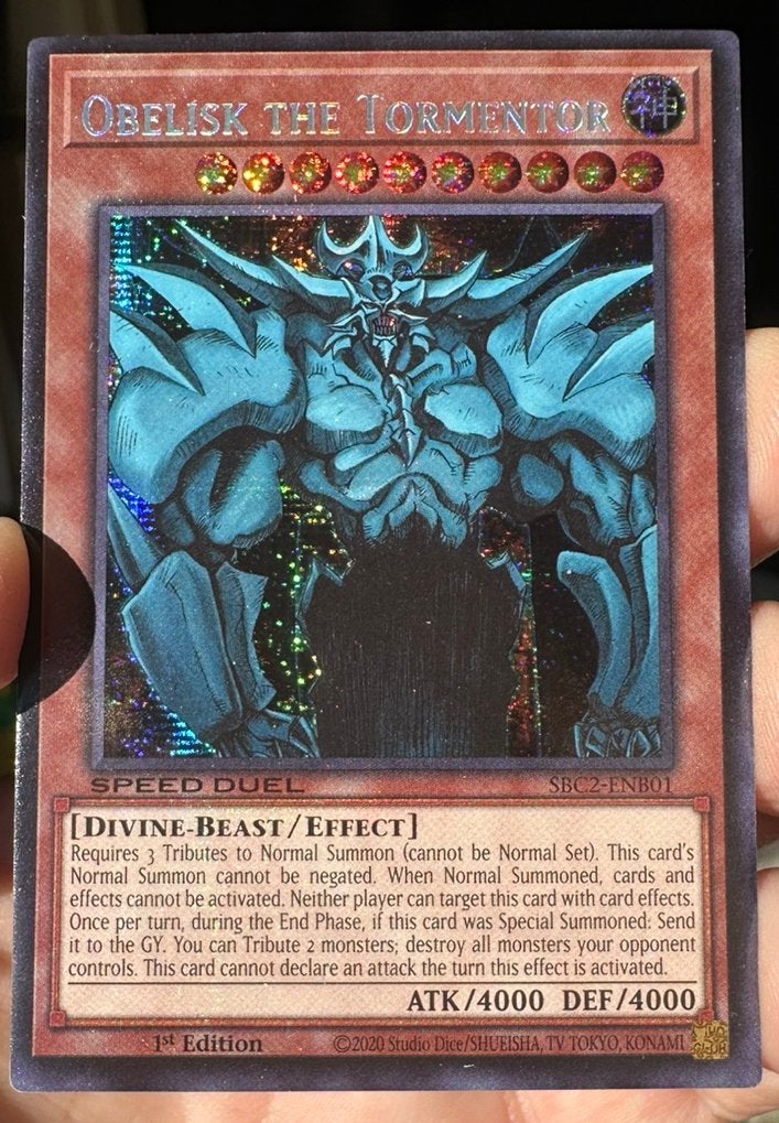 Yu-Gi-Oh! Obelisk the Tormentor SBC2 1st Duel Promo !, Ophalen of Verzenden, Zo goed als nieuw, Losse kaart, Foil