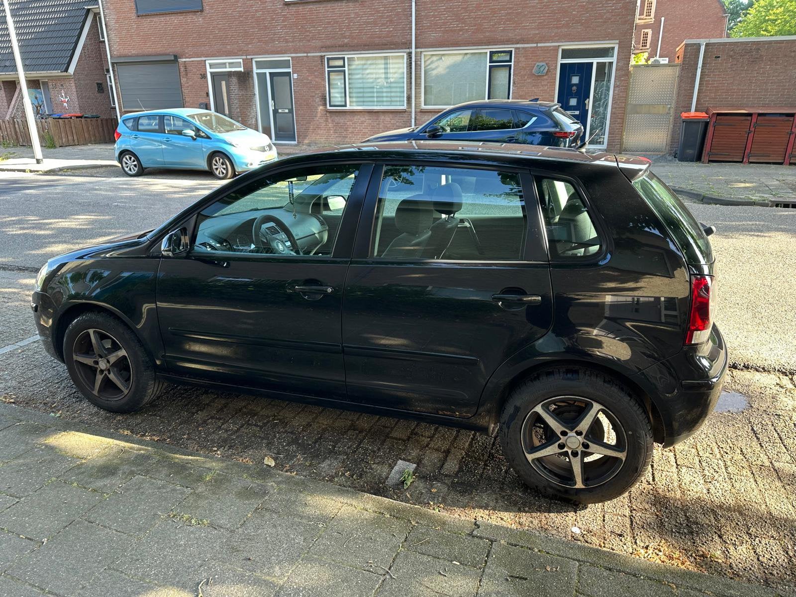 Volkswagen Polo 1.2 47KW Cross 2005 Zwart, Auto's, Volkswagen, Voorwielaandrijving, Stof, 540 kg, 1198 cc