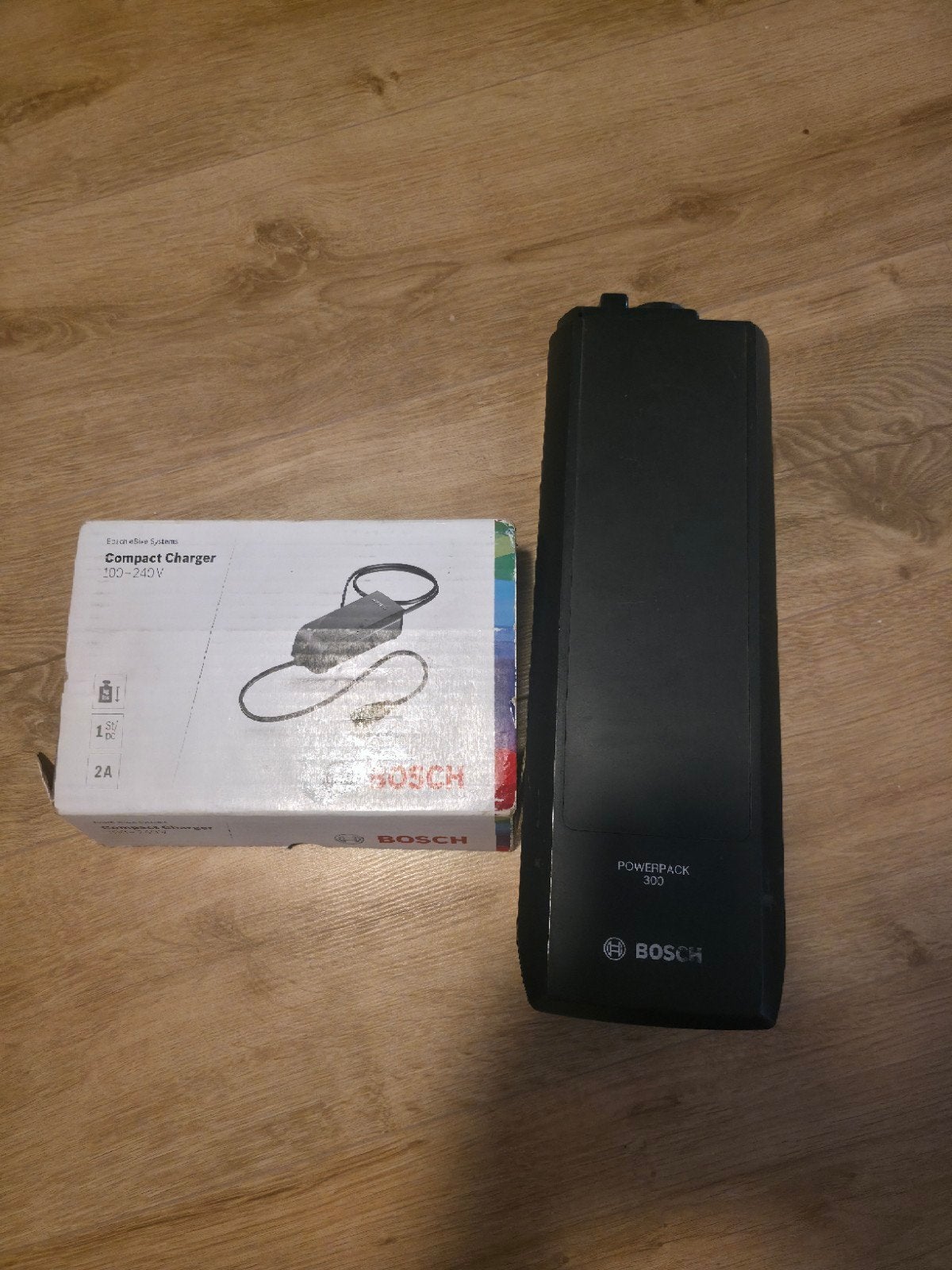 Bosch eBike Compact Charger 2A met PowerPack 300 accu, Ophalen of Verzenden