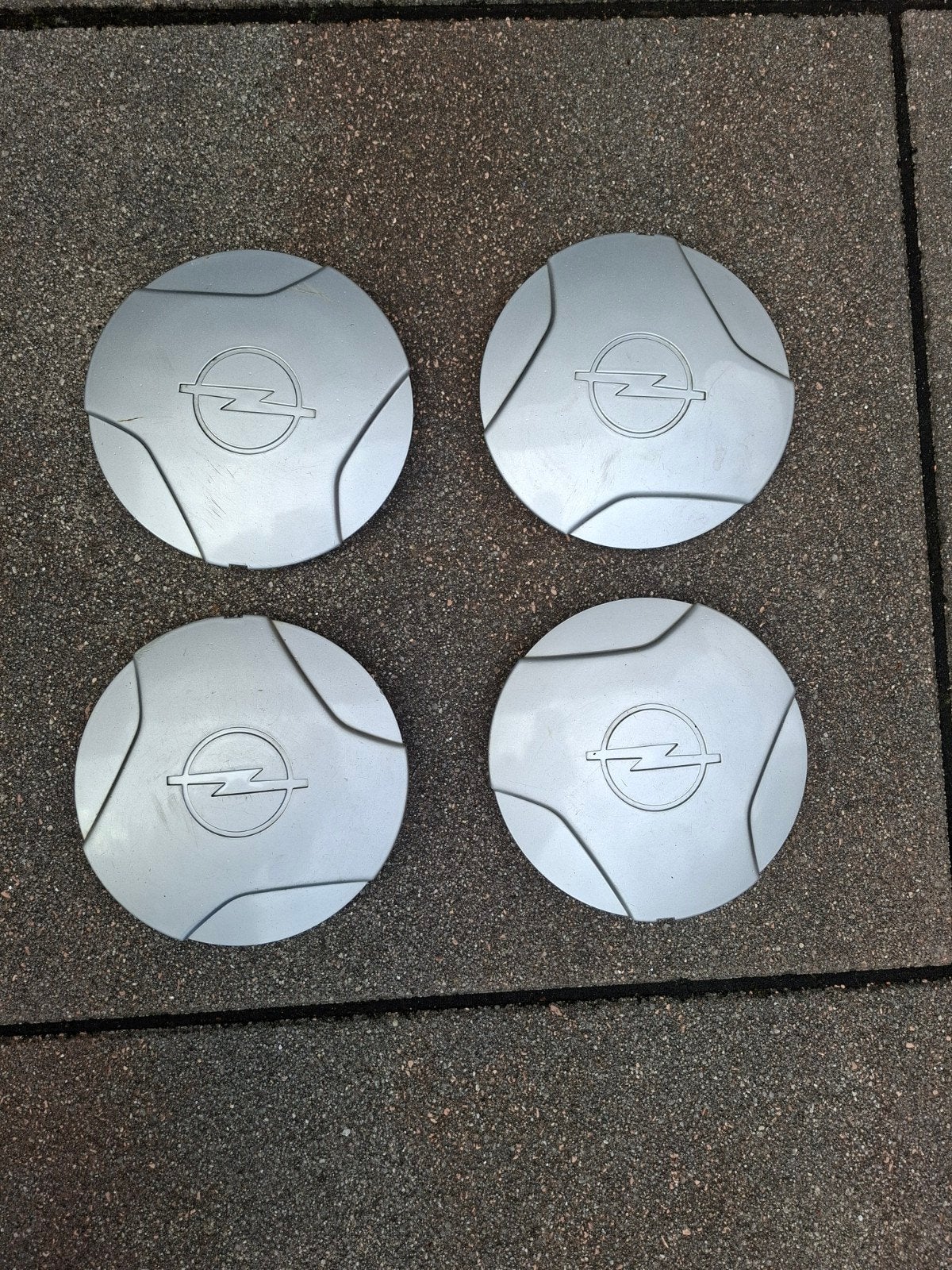 Set van 4 originele Opel/Vauxhall wieldoppen, Auto diversen, Wieldoppen, Ophalen of Verzenden, Gebruikt