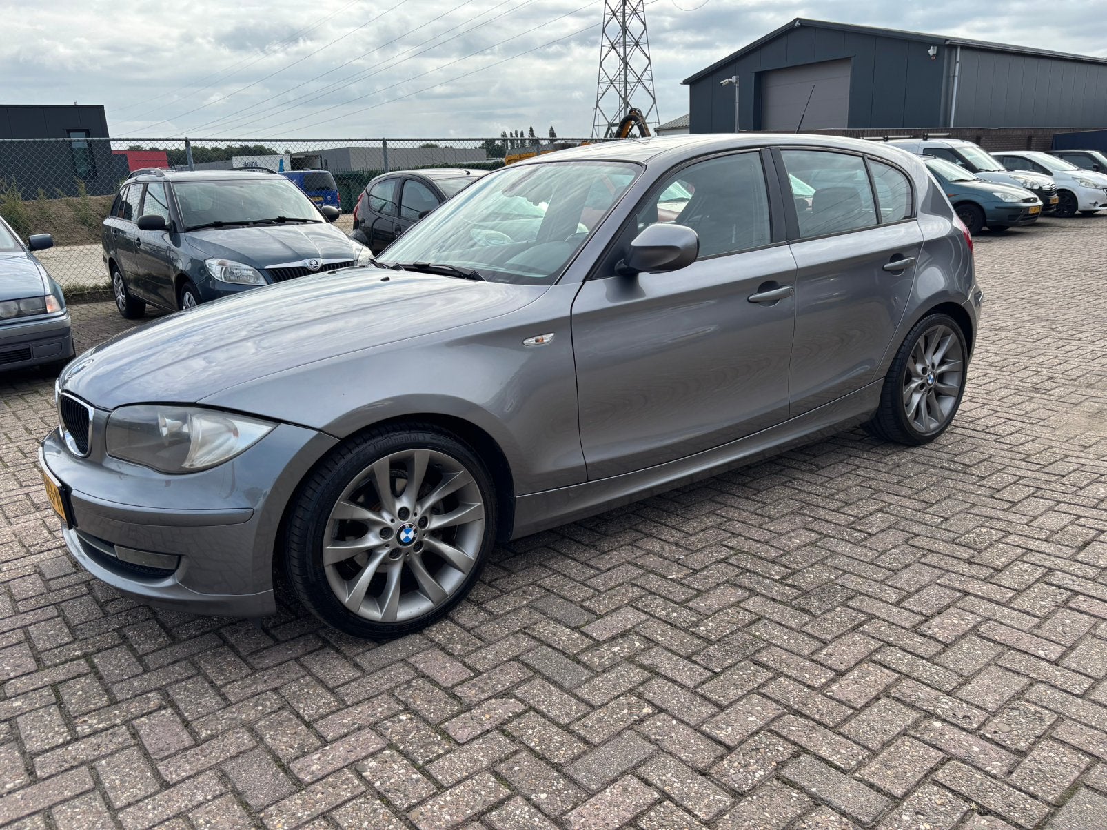 BMW 1-Serie 2.0 116I 5DR AUT 2010 Grijs, 1995 cc, Zwart, 4 cilinders, 122 pk