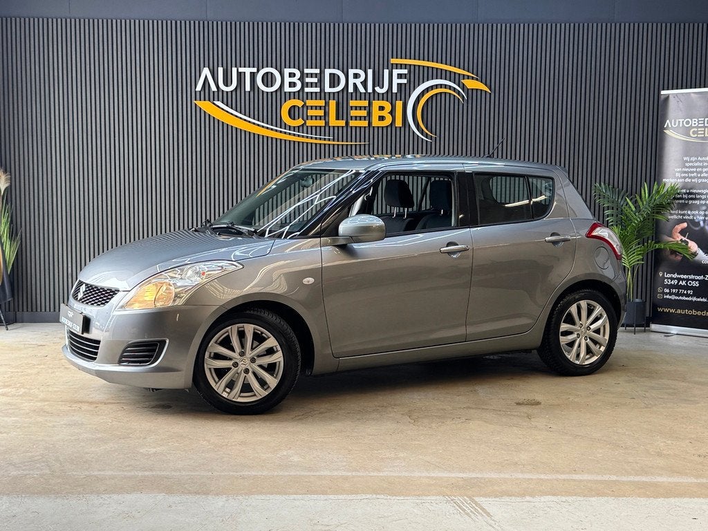 Suzuki Swift 1.2 Comfort 2011 GRIJS AUT|AIRCO|ELEKTRRAMEN, Auto's, Stof, 4 cilinders, 965 kg, Swift