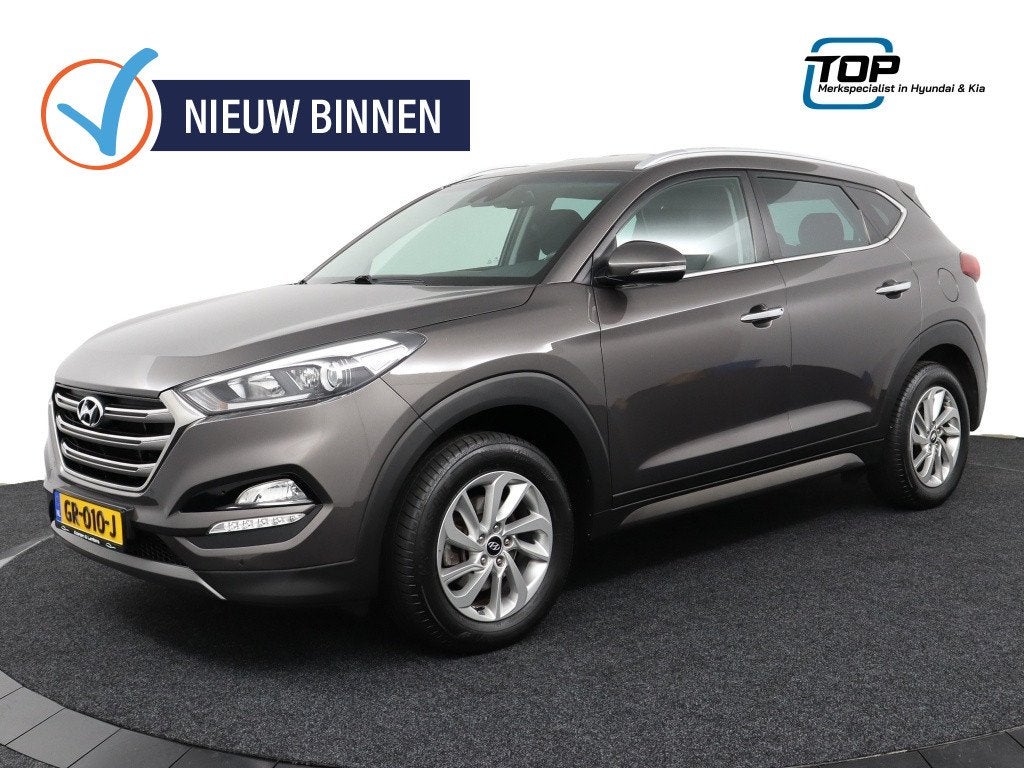 Hyundai Tucson 1.6 GDi Comfort (bj 2015), Auto's, Stof, Gebruikt, 4 cilinders, Bruin