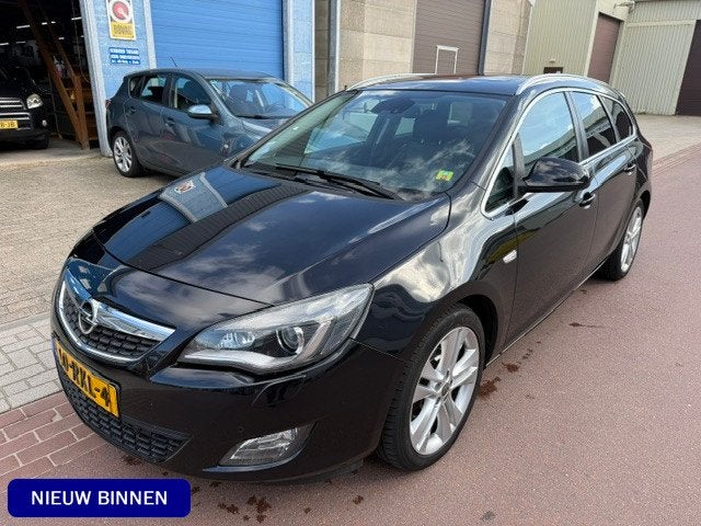 Opel Astra Sports Tourer 1.4 Turbo Sport Automaat 1e eigenaa, Auto's, Euro 5, 15 km/l, Gebruikt, Zwart