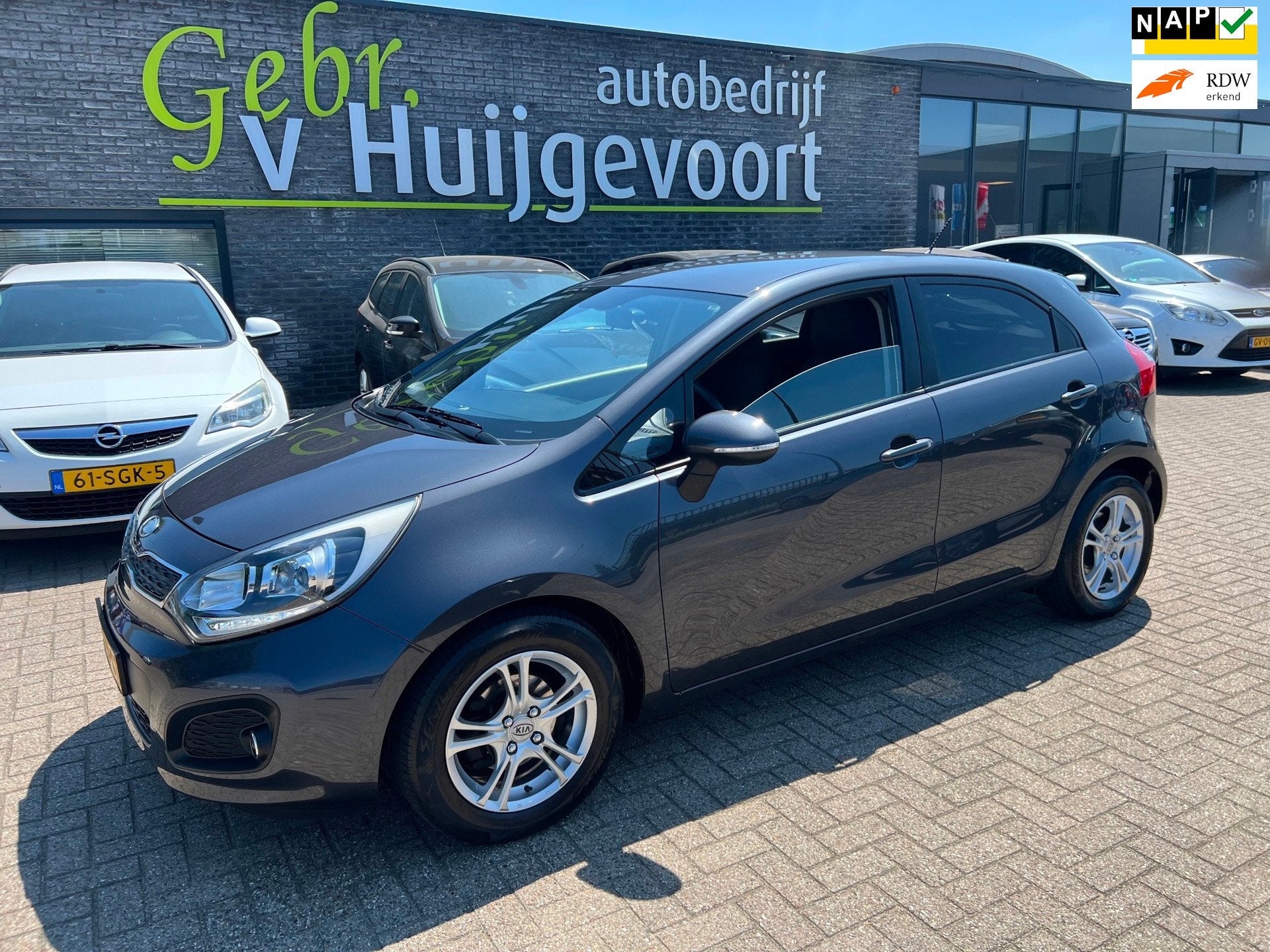 Kia Rio 1.2 CVVT Plus Pack, Auto's, Zwart, 4 cilinders, Origineel Nederlands, Bedrijf