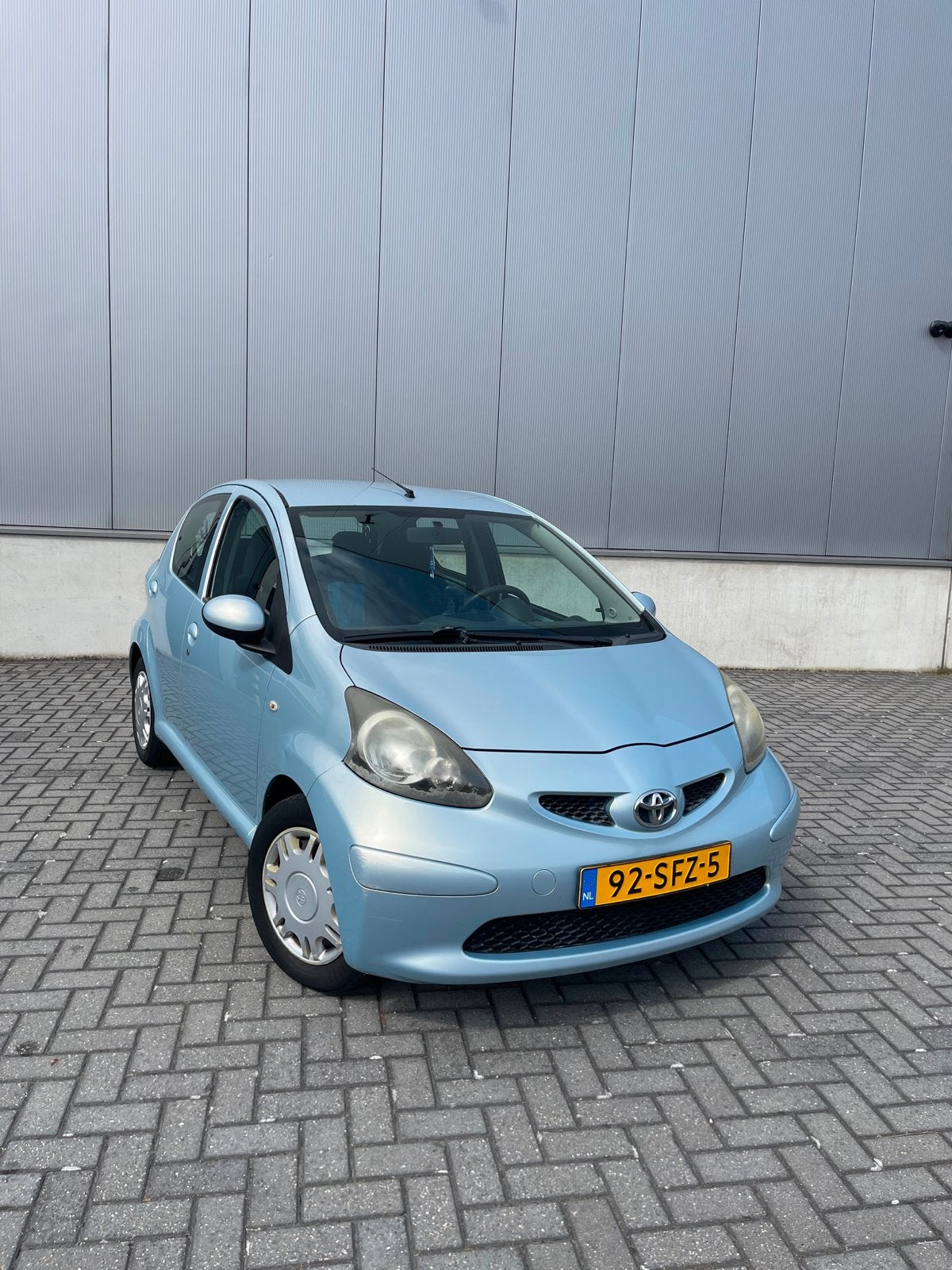 Toyota Aygo 1.0 12V Vvt-i 5DRS 2006 Blauw AIRCO, Auto's, Voorwielaandrijving, Stof, Zwart, 68 pk