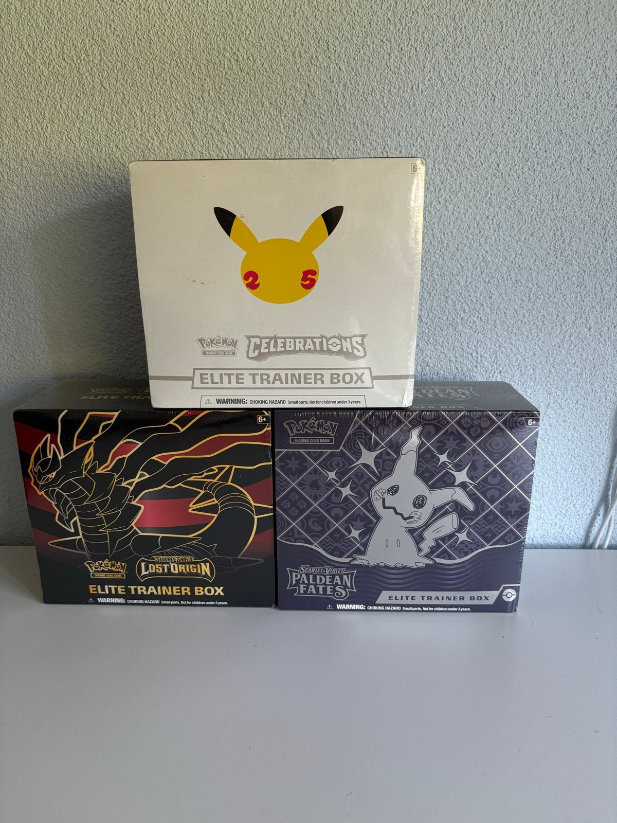 3 Pokémon ETB’s, Celebrations, Lost Origin & Paldean Fates, Ophalen of Verzenden, Nieuw, Boosterbox, Foil