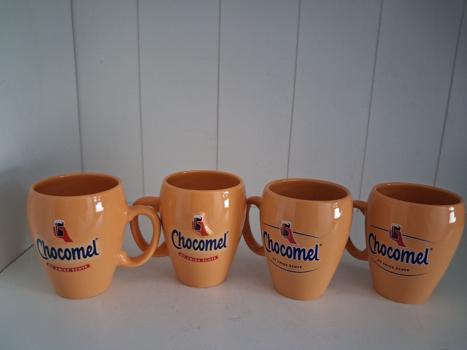 Set van 4 originele Chocomel mokken, Ophalen of Verzenden, Steen/keramiek, Overige merken, Oranje