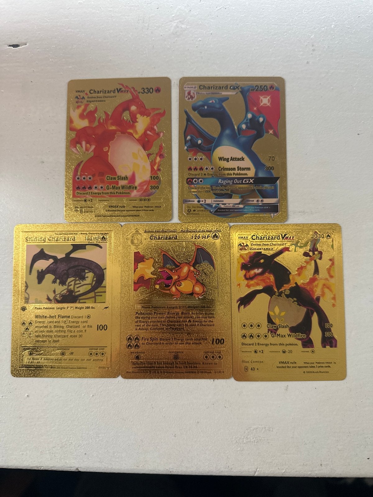 5 Gouden Charizard Pokémon Kaarten, Ophalen of Verzenden, Zo goed als nieuw, Meerdere kaarten, Foil