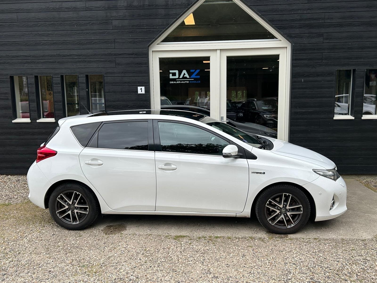 Toyota Auris 1.8 Hybrid Lease Aut/Ecc/Navi/Pano (bj 2014), Auto's, Toyota, Euro 5, Stof, Gebruikt, 4 cilinders