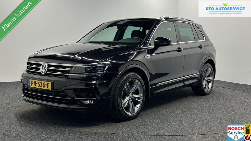 Volkswagen Tiguan 1.4 TSI ACT Comfortline Business R LEER CA, Voorwielaandrijving, 4 cilinders, Zwart, Handgeschakeld