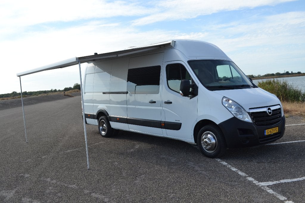 Opel Movano motorsportcamper L4 H3 2011 Wit, Auto's, Zwart, 3000 kg, 11 km/l, Particulier