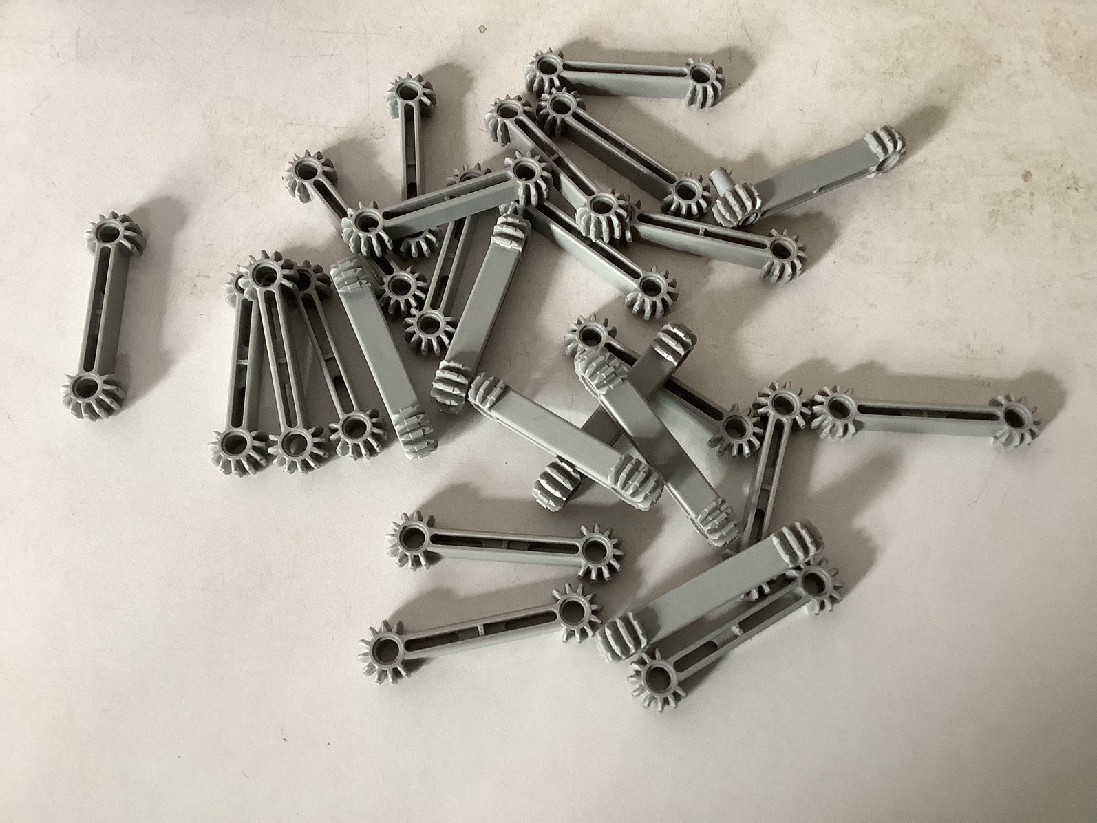 Lego Technic Arm 1x7 with Gear 9 Tooth Double Bevel Ends, Ophalen of Verzenden, Gebruikt, Losse stenen, Lego