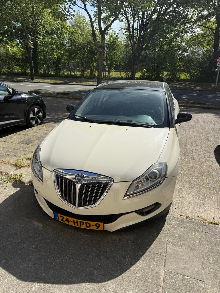 Lancia Delta 1.4 Tjet 120 2009 Wit, Auto's, Voorwielaandrijving, 15 km/l, 1295 kg, 4 cilinders