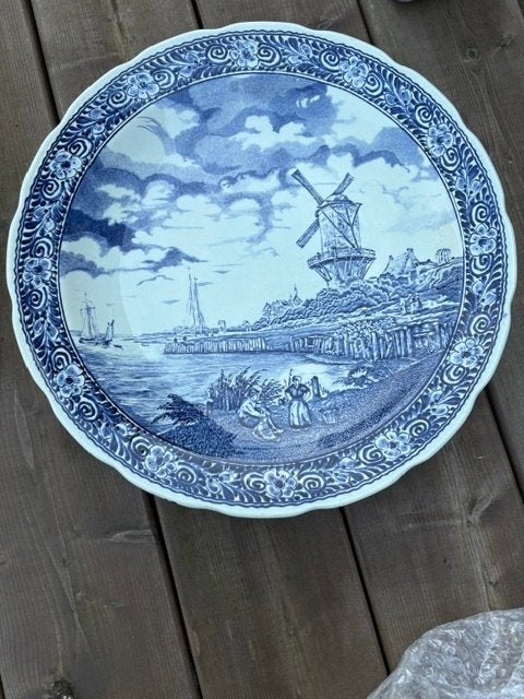 Delfts Blauw wandbord, Ophalen