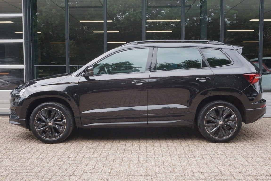 Skoda Karoq 1.5 TSI ACT Sportline Business Camera/Navi/App-C, Auto's, 12 maanden, Stof, 4 cilinders, Automatische klimaatregeling