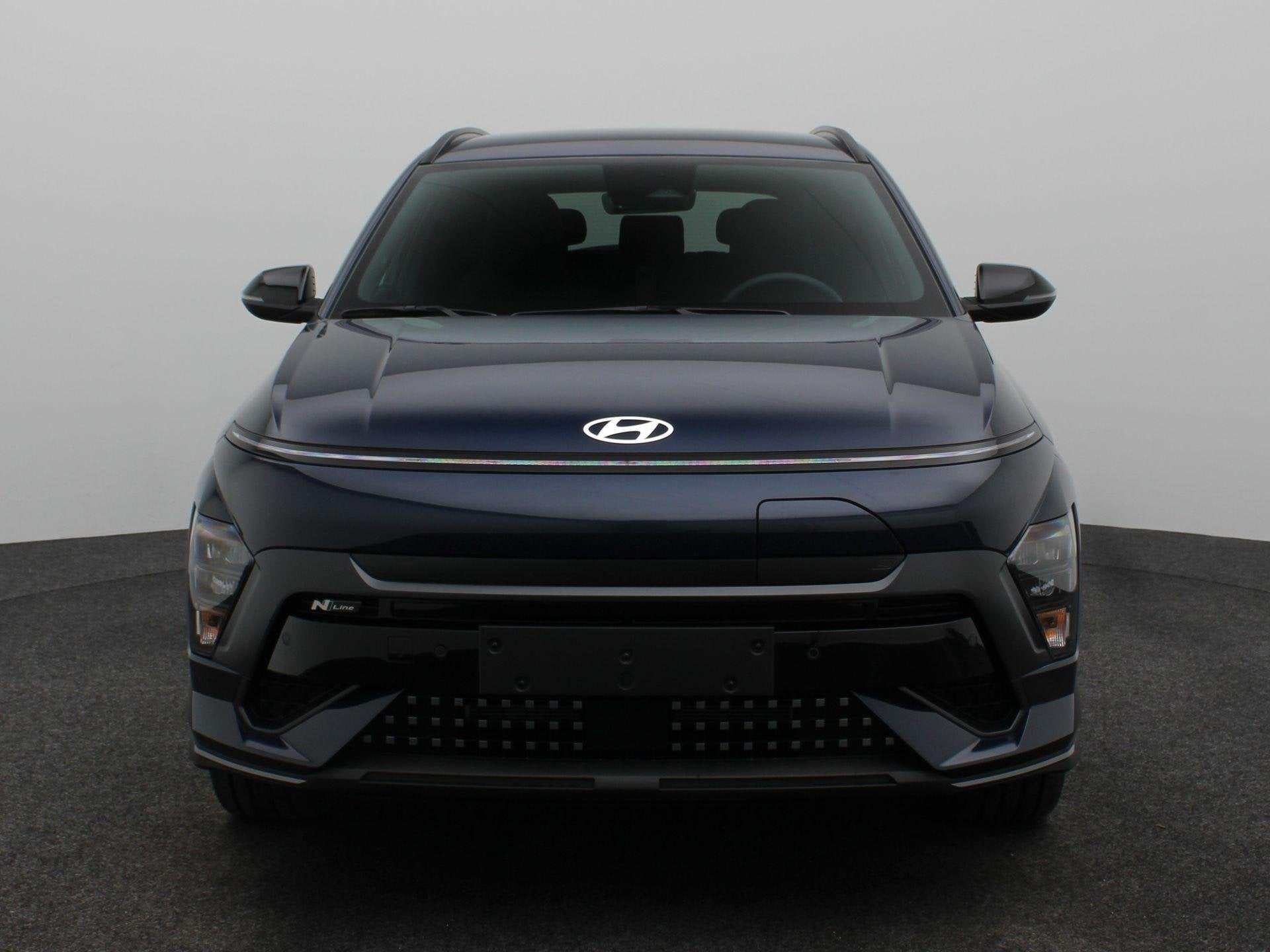 Hyundai Kona Electric N Line Business 64.8 kWh | Warmtepomp, Auto's, Stof, Zwart, Met garantie (alle), Blauw