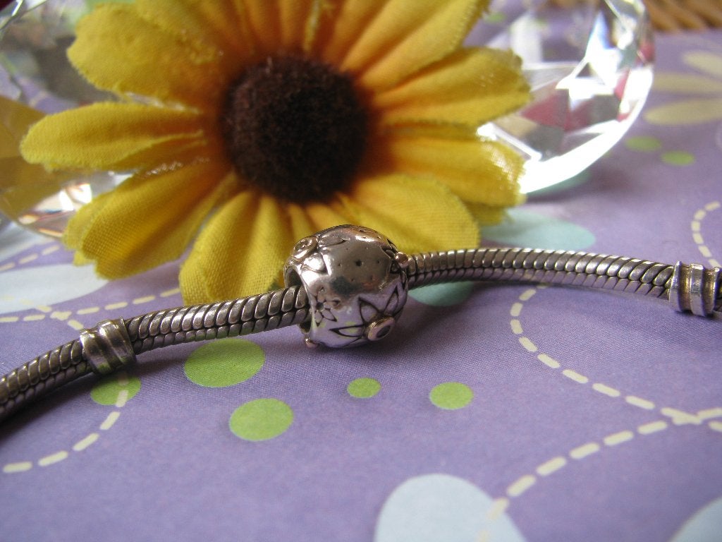 Pandora bedel 790399DN = STARFLOWER + GOUD & DIAMANT, Sieraden, Tassen en Uiterlijk, Gebruikt, Pandora, Ophalen of Verzenden, 1 bedel