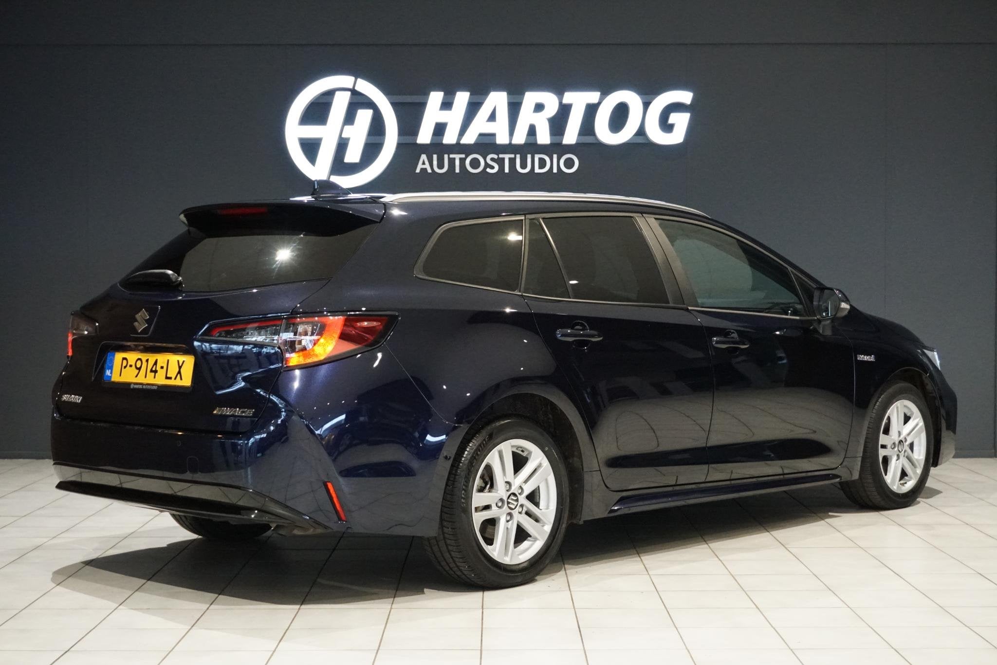 Toyota Corolla 1.8 Hybrid Style + DODEHOEK / STUURVERWARMING, Auto's, Gebruikt, 4 cilinders, Blauw, Corolla