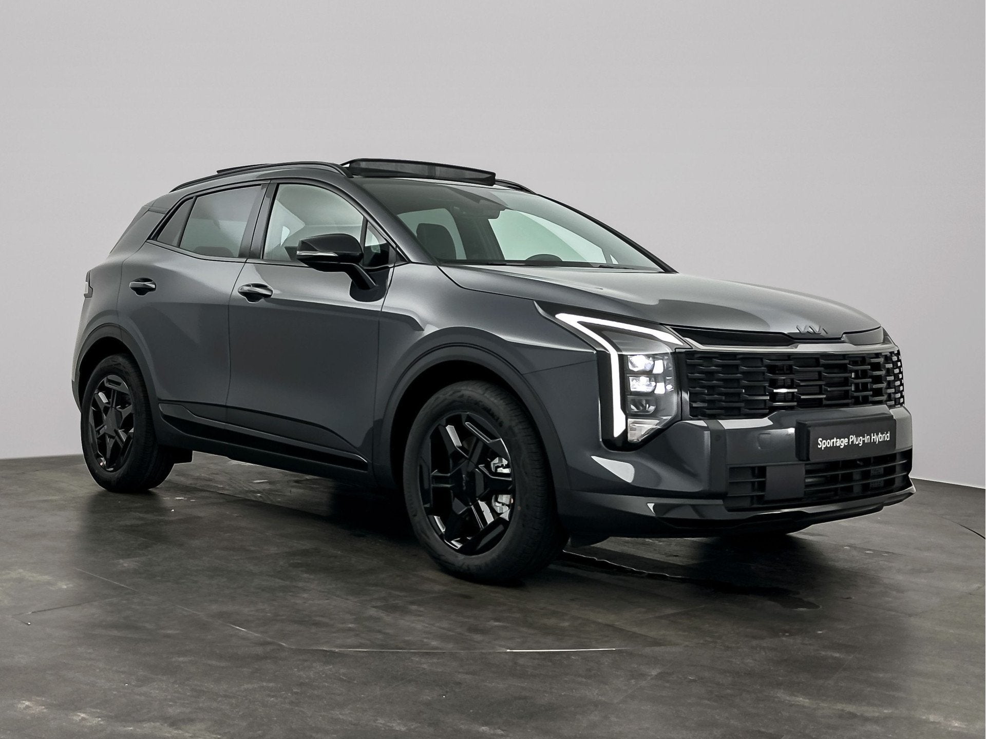 Kia Sportage 1.6 T-GDi Hybrid Black Edition Advanced, Auto's, Zwart, 4 cilinders, Leder, Hybride Elektrisch/Benzine