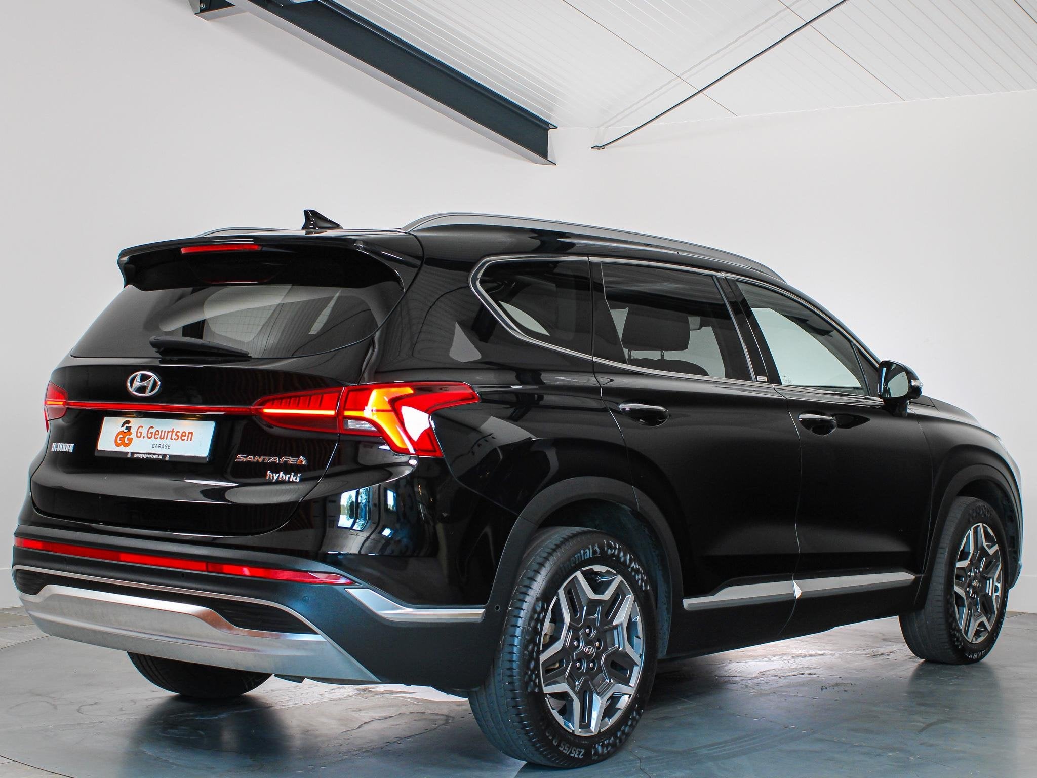 Hyundai Santa Fe 1.6 T-GDI HEV Premium Sky 7-Persoons Panora, Auto's, Santa Fe, Gebruikt, 4 cilinders, Leder