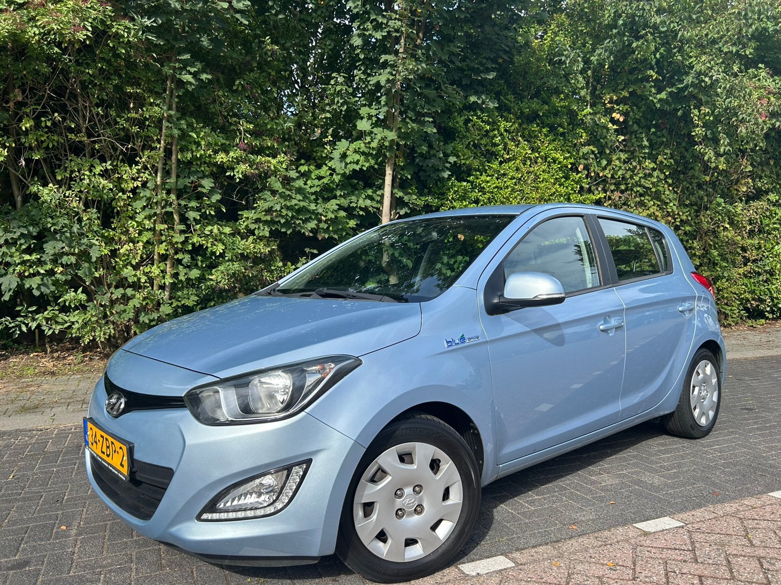 Slechts 90.564km&NAP 1e eigen. Hyundai i20 1.2I 5-DRS 2012, Auto's, 450 kg, 31 €/maand, 4 cilinders, Blauw