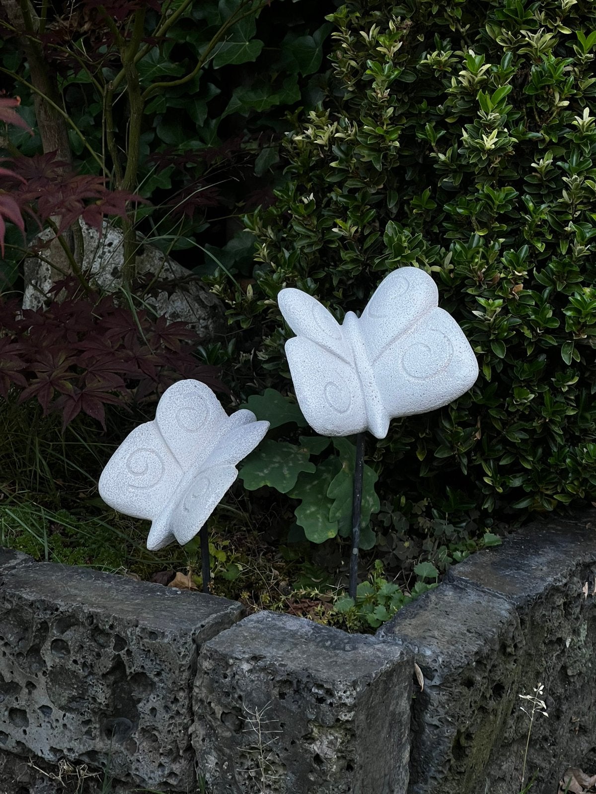 Vlinder sculpturen op stok, Ophalen