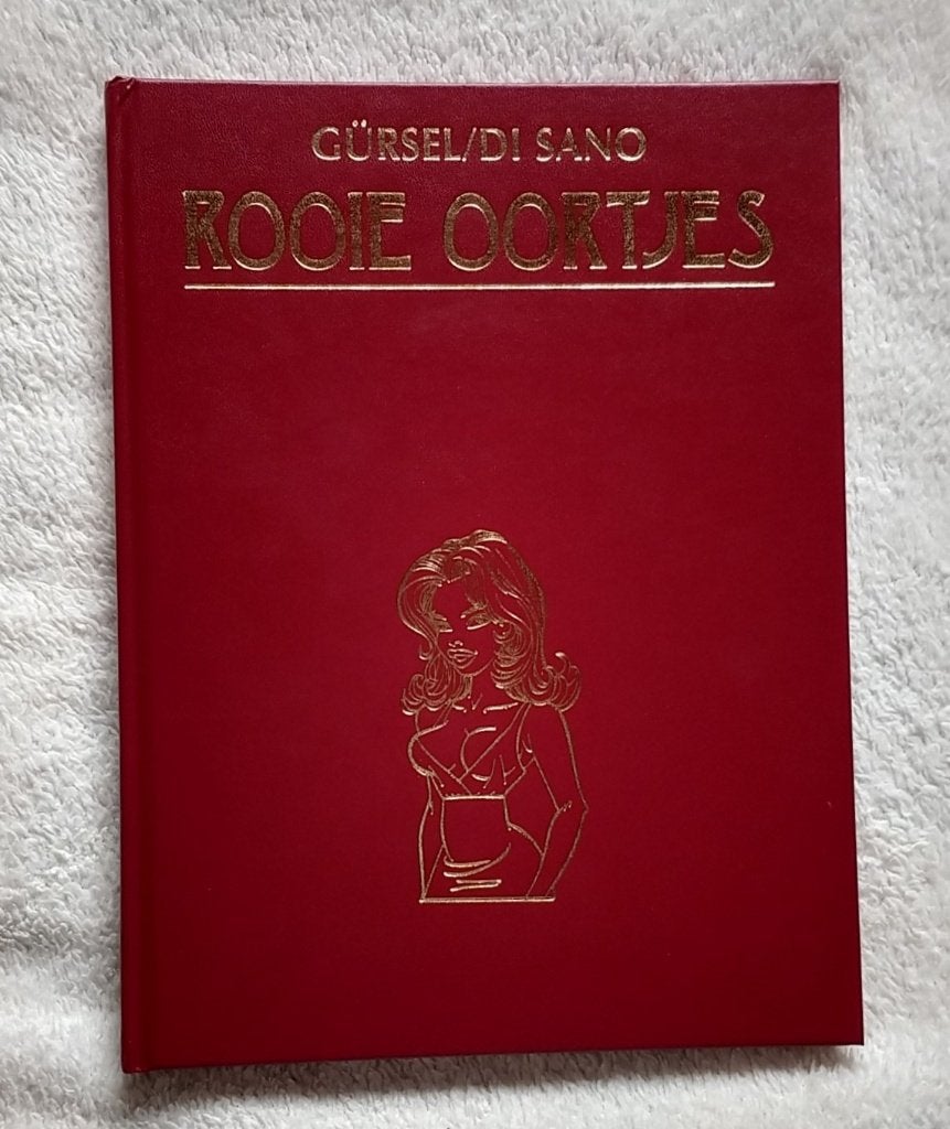 rooie oortjes hardcover, Gürsel Di Sano, volgnr 21, Boeken, Stripboeken, Eén stripboek, Ophalen of Verzenden, Zo goed als nieuw