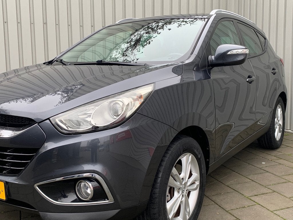Hyundai Ix35 2.0i Business Edition|Navigatie|149000KM|Climat, Auto's, Hyundai, Zwart, 4 cilinders, Leder en Stof, 163 pk