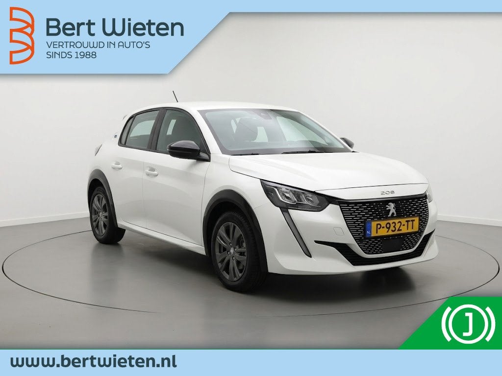 Peugeot e-208 Active Pck 50 kWh | Geen import | Navi | Cruis, Auto's, Dealer onderhouden, Gebruikt, Zwart, Wit