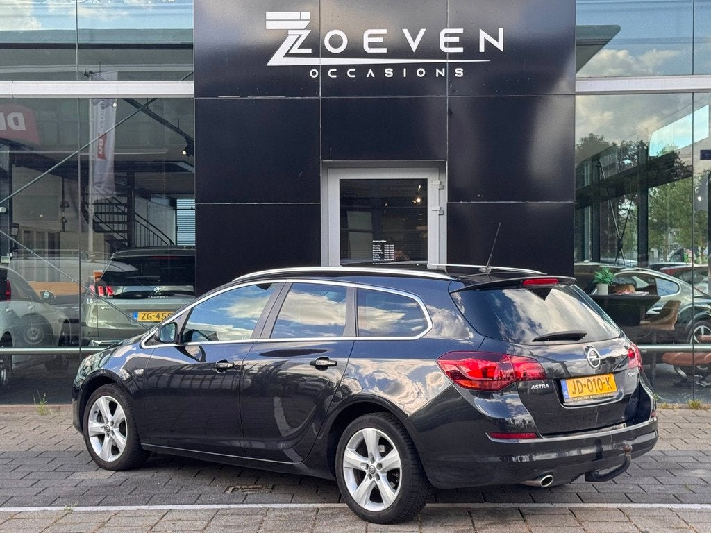 Opel Astra Sports Tourer 1.4 Turbo Cosmo, Auto's, Opel, Voorwielaandrijving, Euro 5, Stof, Gebruikt