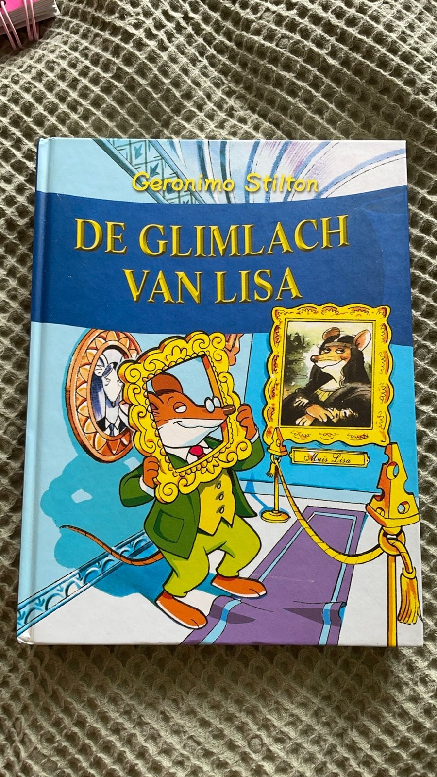 Geronimo Stilton: De Glimlach van Lisa - Avontuurlijk Boek, Ophalen of Verzenden, Zo goed als nieuw, Fictie algemeen