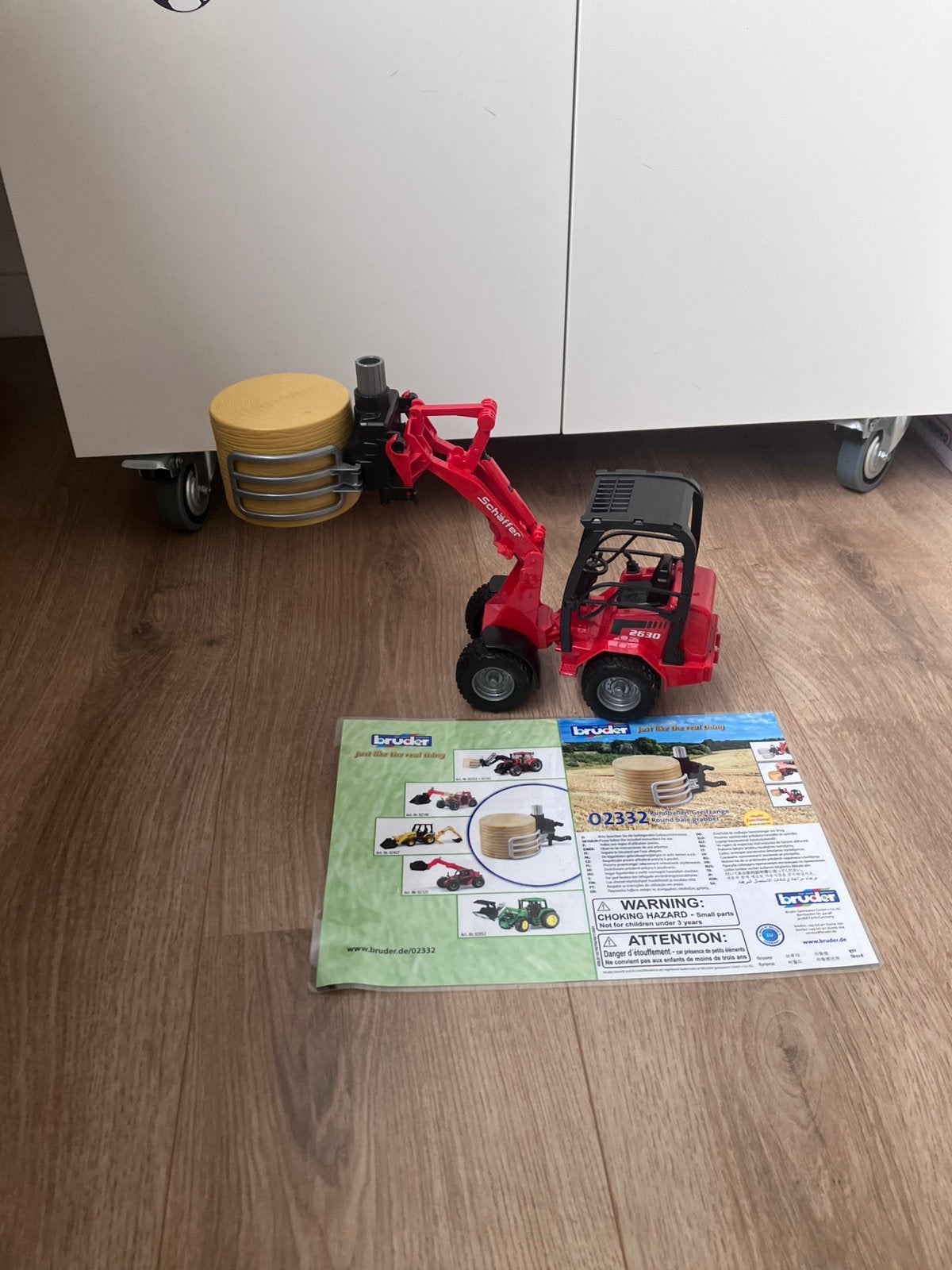 Bruder 02192 compactlader met balengrijper, Kinderen en Baby's, Speelgoed | Speelgoedvoertuigen, Ophalen, Zo goed als nieuw