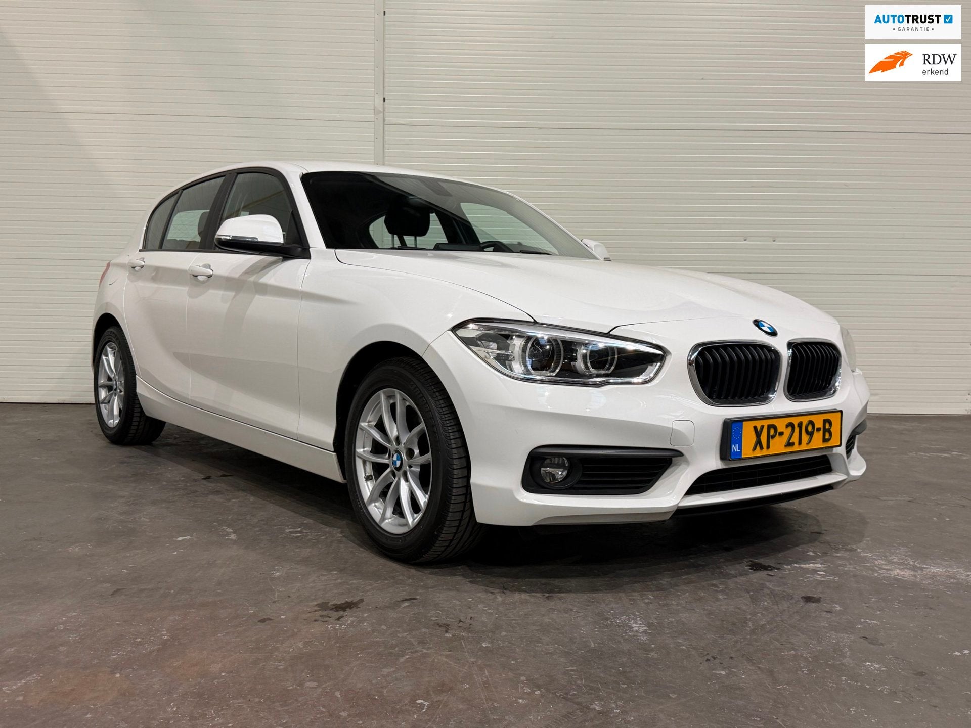 BMW 1-serie 118i Executive PDC / LMV / Automaat / Cruise Con, Auto's, Gebruikt, Wit, Origineel Nederlands, Bedrijf
