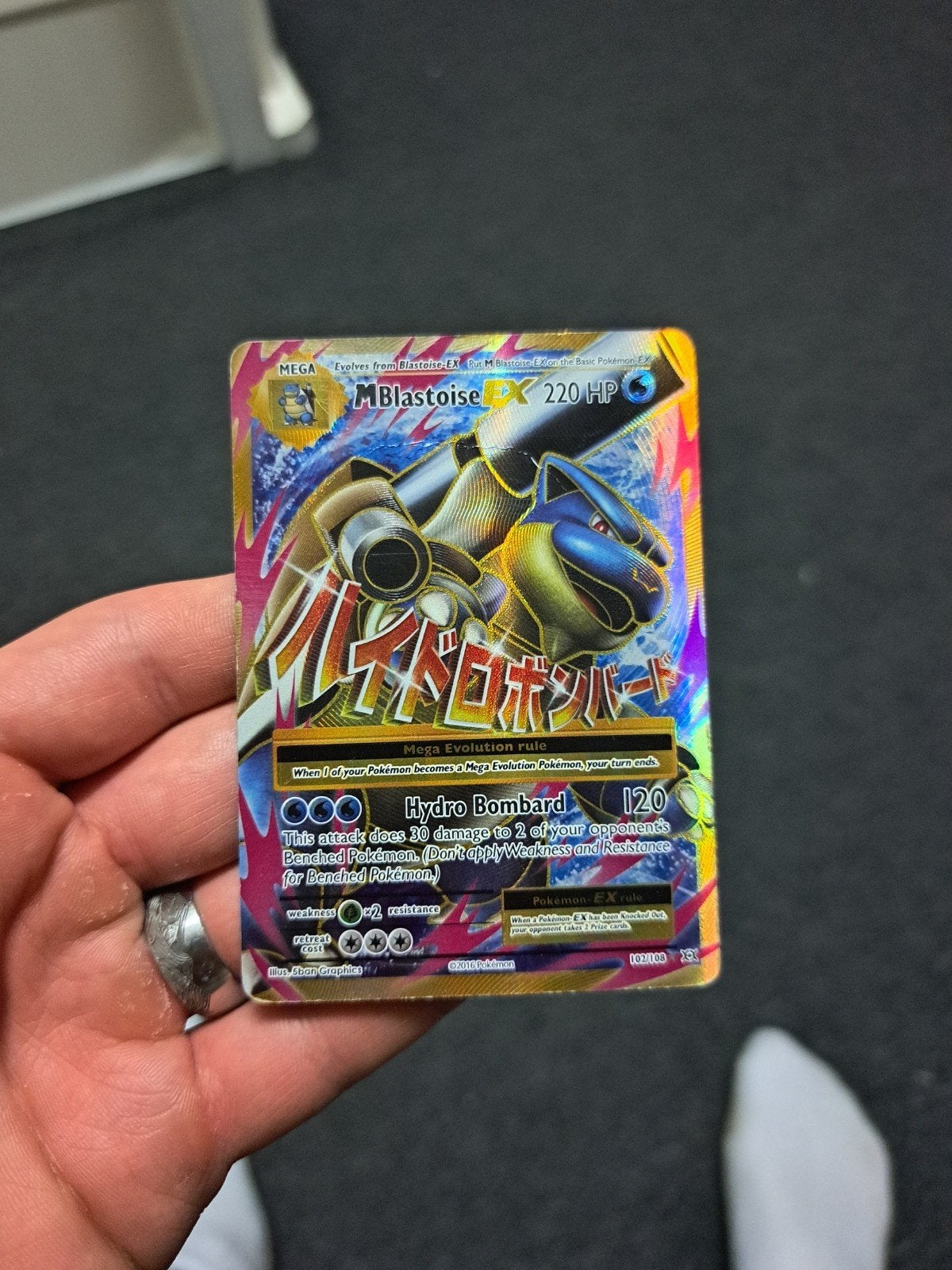 M Blastoise EX Pokémon kaart met lichte vouw, Ophalen of Verzenden, Gebruikt, Losse kaart, Foil