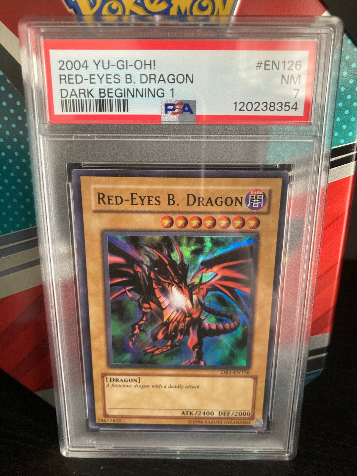 Yu-Gi-Oh! Red-Eyes B. Dragon PSA 7 - Dark Beginning 1, Ophalen of Verzenden, Zo goed als nieuw, Losse kaart, Foil