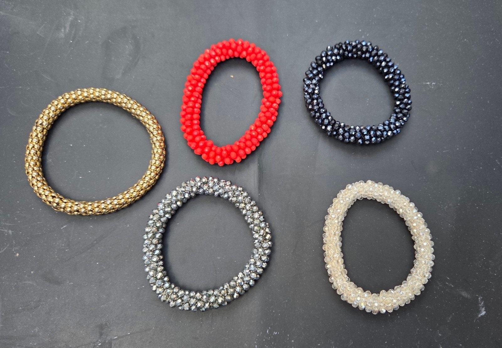 Set van 5 elastische armbanden, Ophalen of Verzenden, Gebruikt, Overige kleuren, Elastiek