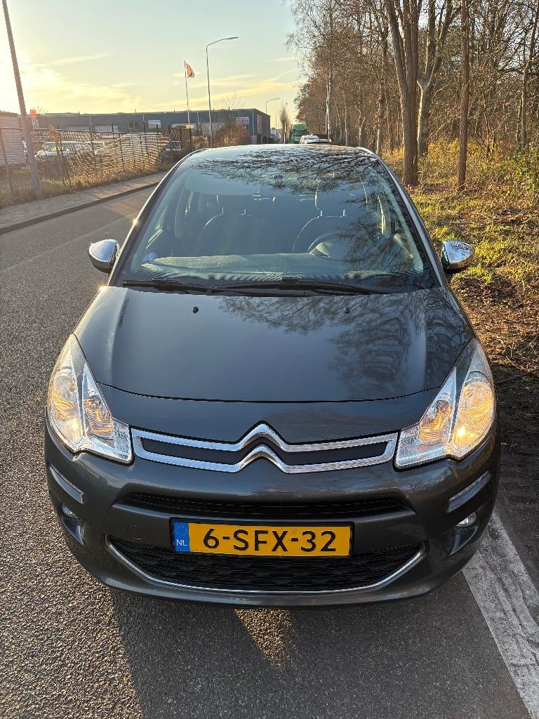 Citroën C3 1.2 VTI 60KW/82PK 2013 Grijs model 2014, Auto's, Voorwielaandrijving, 31 €/maand, 1199 cc, Leder en Stof
