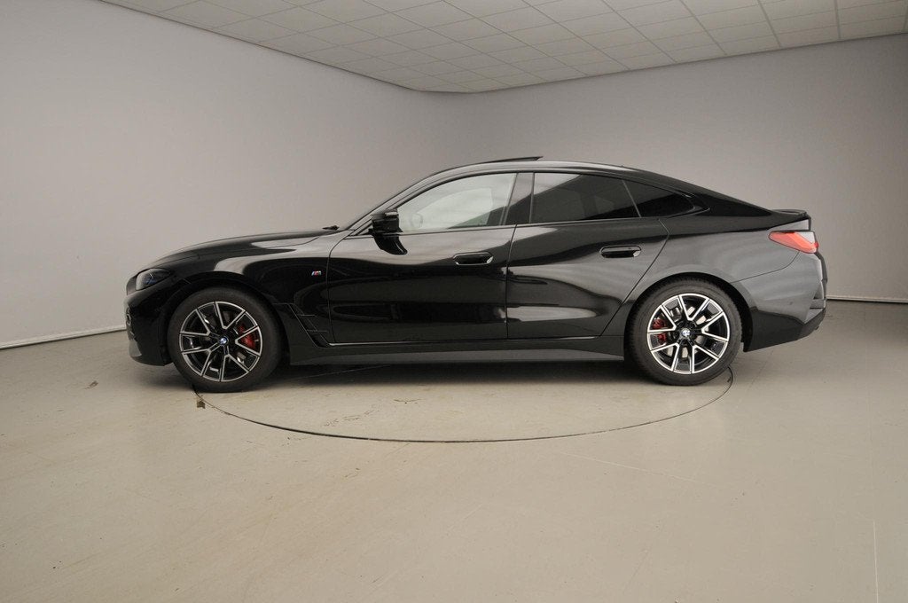 BMW 4 Serie Gran Coupé M440i xDrive M-Sportpakket | Laserli, Auto's, BMW, 12 maanden, 1800 kg, Zwart, Bedrijf