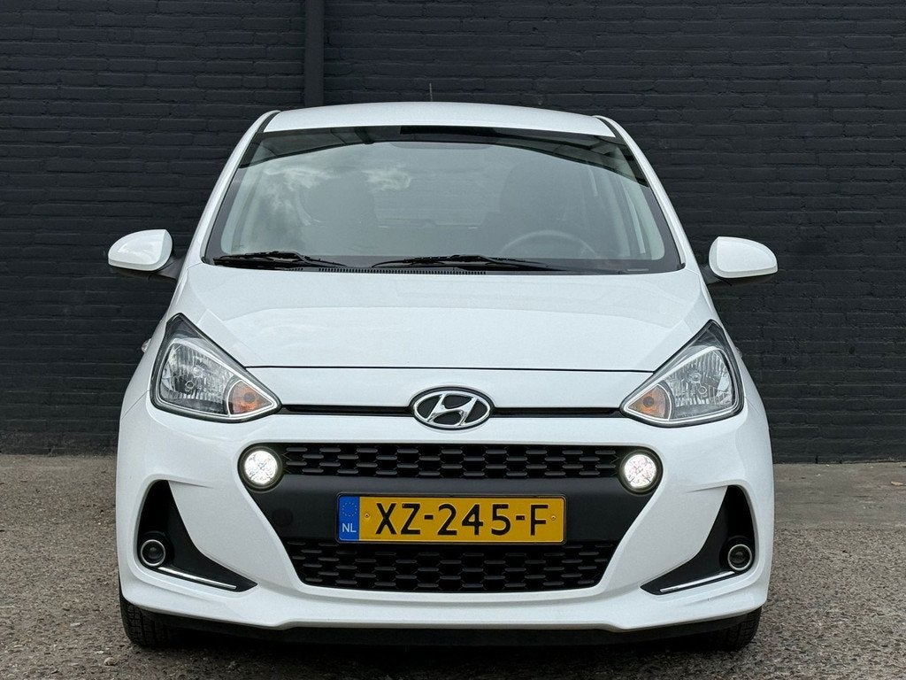 Hyundai I10 1.0i Comfort AIRCO | CRUISE | ELEK RAMEN | NWE A, Auto's, Stof, Gebruikt, 4 stoelen, Wit